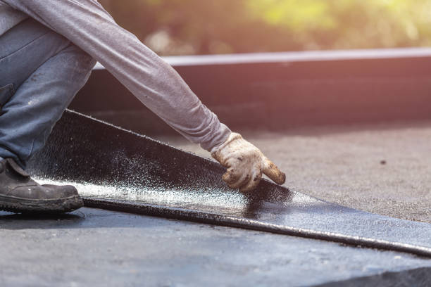 Professional Basement Waterproofing technician working in Burlington, ND